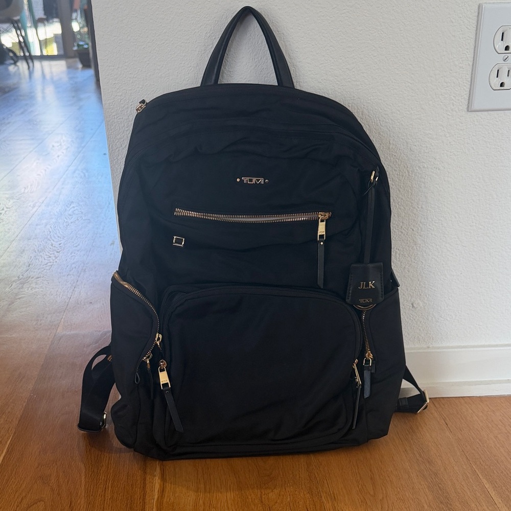 Tumi Black and Gold Backpack